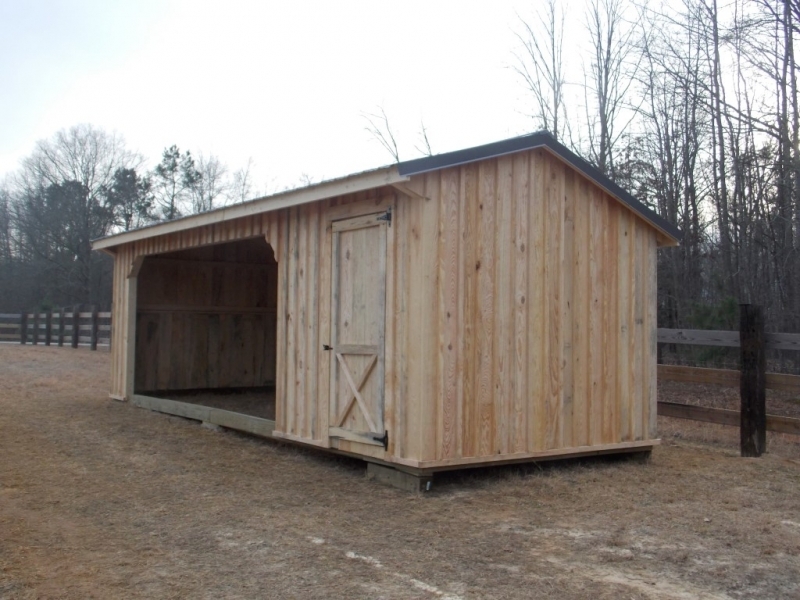 10x26 foot horse run in with a 6x10 foot tackroom with metal roofing and board and batten siding